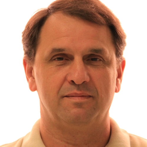 Head shot of male with short hair.