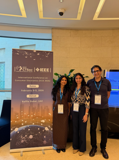 Photo of Prof. Haghani with two students at ICCE 20226